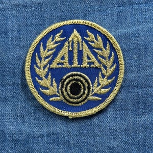 May include: A white ceramic mug with a black handle and the text "But First, Coffee" in a black, bold font. The mug is likely 4 inches tall and holds approximately 12 ounces of liquid.