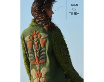 Spine tingling pleasures  Long green coat with unique craft decoration on the back