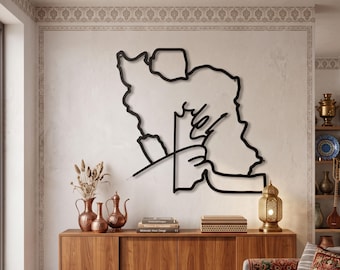 May include: A black metal wall art piece featuring a continuous line drawing of the map of Iran. The design is mounted on a light-colored wall above a wooden sideboard. The artwork displays a stylized, minimalist outline of the country's borders.