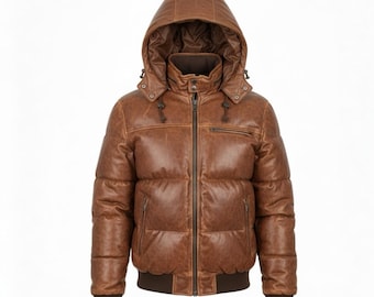 May include: A brown leather puffer jacket with a hood. The jacket has a zip-up front, a small chest pocket, and ribbed cuffs and hem. The hood has drawstrings. The jacket is a medium brown color.