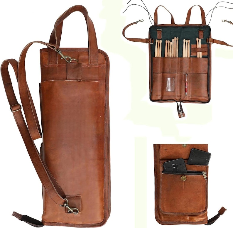 May include: A brown leather drumstick bag with a shoulder strap and a top handle. The bag has multiple pockets and compartments for drumsticks and accessories. The bag is made of a durable leather material and has a vintage look.