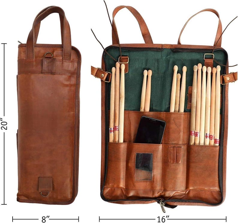 May include: A brown leather drumstick bag, 20 inches tall, 8 inches wide when closed, and 16 inches wide when open. The bag has a handle and a shoulder strap. Inside, it holds drumsticks and a smartphone. The interior is green.