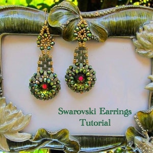May include: A pair of green and gold dangle earrings with a red crystal in the center of each earring. The earrings are displayed in a green and gold picture frame with the text "Swarovski Earrings Tutorial".