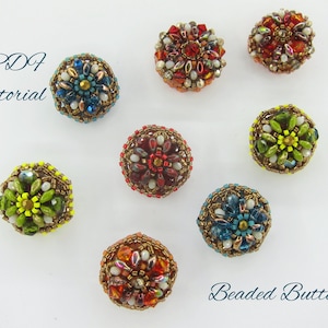 May include: A collection of seven beaded buttons with various colors and patterns. The buttons are round and have a raised center with a flower design. The colors include red, green, blue, yellow, and white. The text "PDF Tutorial" and "Beaded Buttons" are visible in the image.