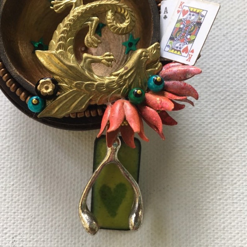 falkor one of a kind and original hanging art ornament. wishbone blackjack love dragon assemblage good luck