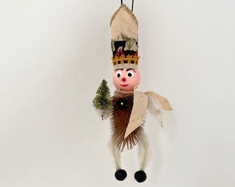 toy soldier assemblage art ornament. found object folk art. one of a kind christmas ornament.