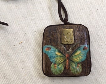 assemblage art pendant necklace. found object art jewelry. one of a kind and original. butterfly.