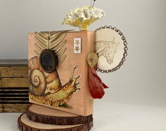 snail jockey assemblage folk art. mixed media quirky one of a kind and original. horse vs snail.