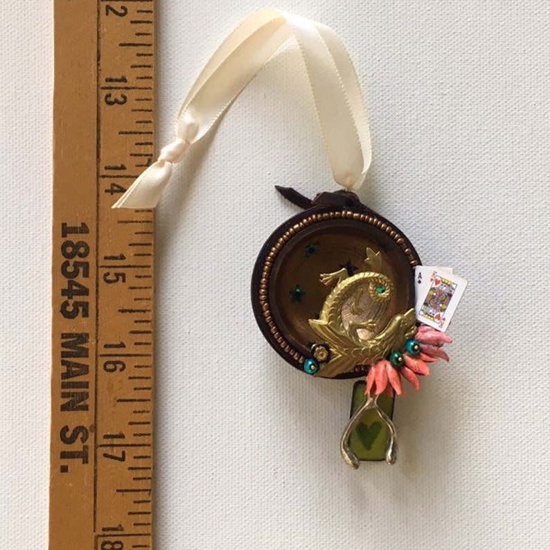 falkor one of a kind and original hanging art ornament. wishbone blackjack love dragon assemblage good luck