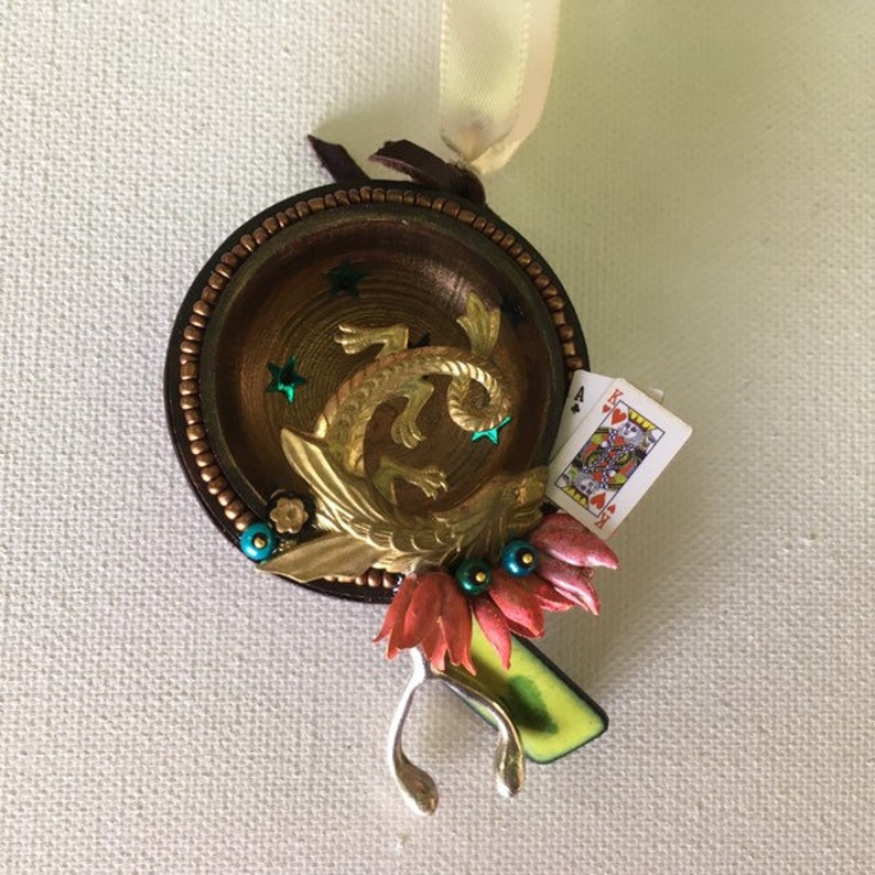 falkor one of a kind and original hanging art ornament. wishbone blackjack love dragon assemblage good luck