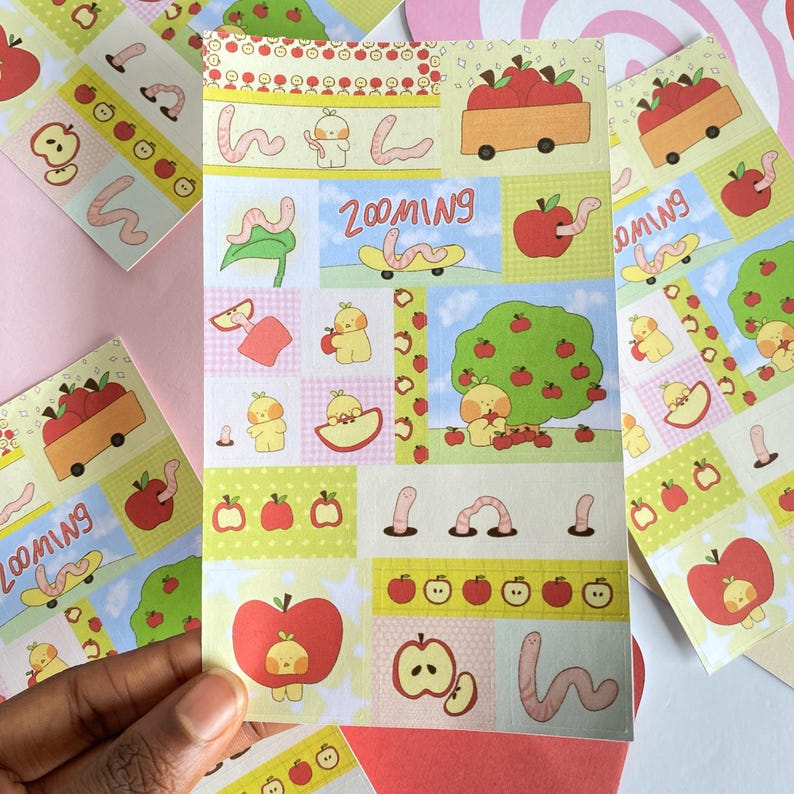 Apple and Worm Sticker Sheet – Cute Kawaii Stickers for Journaling, Scrapbooking, Planners | Lil Things Club Original Art

May include: A sheet of colorful stickers featuring apple and worm illustrations. The stickers have a variety of designs, including apples, worms, and apple trees. Some stickers have the word 'Zooming' on them. The color palette includes red, green, yellow, and blue.