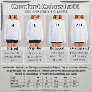 Puede incluir: Se muestran sudaderas blancas de cuello redondo Comfort Colors en tallas M, L, XL y 2XL. La imagen incluye una tabla de tallas con medidas en pulgadas y detalles sobre la composici&oacute;n de la tela y el ajuste.