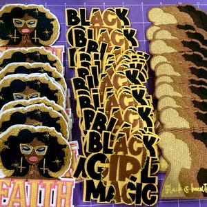 May include: A collection of embroidered patches featuring three distinct designs: a figure with dark hair and glasses labeled FAITH, the text BLACK GIRL MAGIC in bold gold and black lettering, and a silhouette profile with the text Black is beautiful.