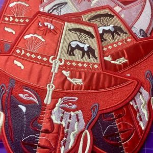 May include: A white ceramic mug with a black handle and the text "But First, Coffee" in a black, handwritten-style font. The mug is on a white surface.