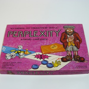 May include: A pink box for the board game "Perplexity" according to "Professor" Hoyle. The box features a cartoon illustration of a man with a beard and glasses holding a deck of cards. The game is described as a family card game.