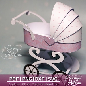 May include: A papercraft baby carriage in shades of pink and white. The carriage features a heart-shaped accent and a polka-dot canopy. The wheels are black with white spokes. Text on the image reads "PDF | PNG | DXF | SVG" and "Digital Files Instant Download."