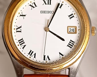 Reloj de vestir Seiko 7N42-8080 de cuarzo con esfera romana, fecha y dos tonos, años 90, correa nueva