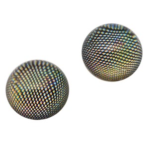 May include: Two iridescent black and blue round buttons with a textured pattern.