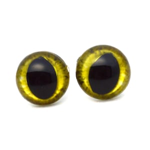 May include: Two yellow and black plastic eyes with a shiny finish. The eyes are round and have a black pupil in the center.