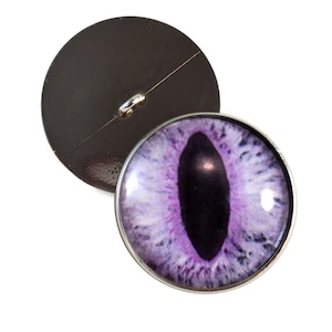 May include: A set of three ceramic mugs with a speckled, matte finish. The mugs are in shades of cream, light gray, and dark gray. Each mug has a simple, minimalist design and a rounded handle.