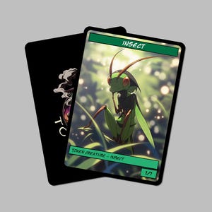 May include: Two trading card game cards. One card is black with a white design. The other card features a green insect illustration with the word "INSECT" at the top and "TOKEN CREATURE - INSECT" at the bottom.