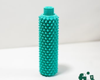 Juguete estimulante con pinchos y clic