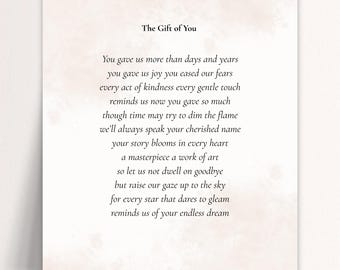 May include: A printed card with the title "The Gift of You" and a poem. The poem is written in a classic serif font on a white background with a soft, watercolor-like wash in shades of beige and pink.