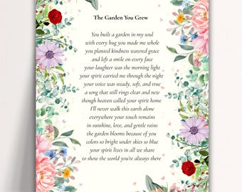 May include: A framed print with the title "The Garden You Grew" and a poem. The border features watercolor flowers in shades of pink, red, purple, and yellow, with green foliage and small butterflies. The poem is written in black text.
