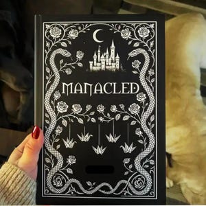手錠をかけられたイラスト入りコレクターズハードカバーブック、アートプリントとブックマーク付き完全版