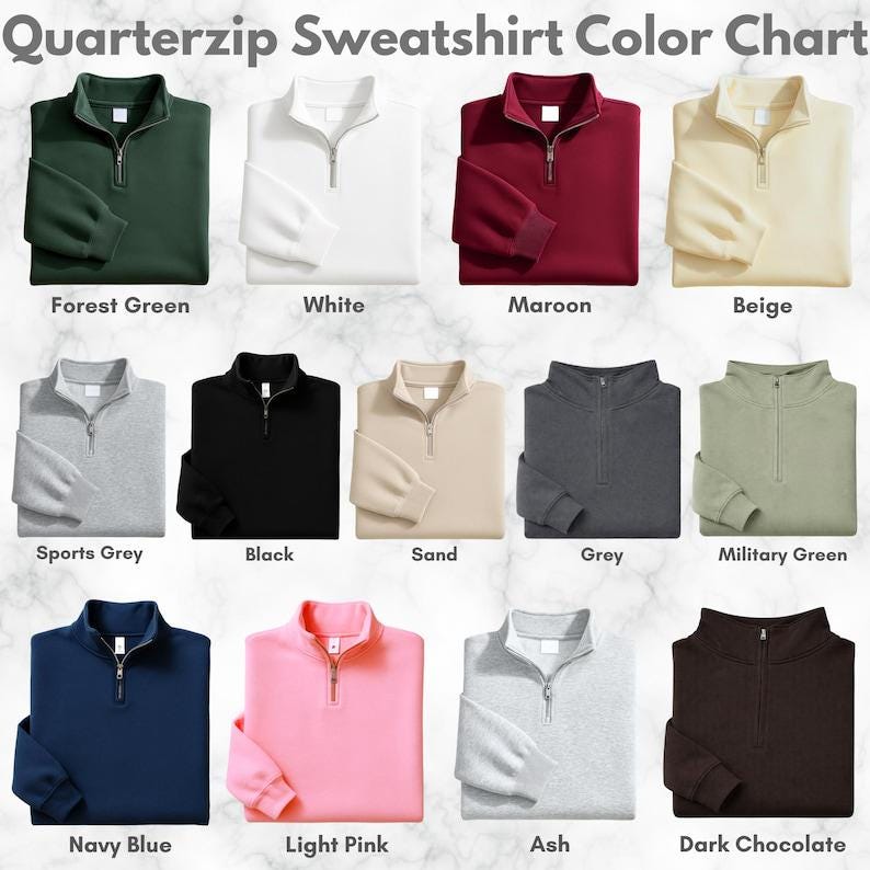 Puede incluir: Una carta de colores de sudaderas con cremallera de cuarto en varios colores, incluyendo Verde Bosque, Blanco, Granate, Beige, Gris Deportivo, Negro, Arena, Gris, Verde Militar, Azul Marino, Rosa Claro, Ceniza y Chocolate Oscuro. Cada sudadera tiene una cremallera plateada.