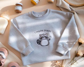 Sudadera infantil con mapache bordado, "Necesito bocadillos", suéter divertido y cómodo