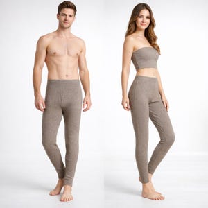 May include: A white ceramic mug with a black handle and the text "But First, Coffee" in a handwritten style. The mug is on a white surface. The mug is 10 cm tall.