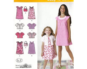 Simplicity 2270 Eenvoudig te naaien meisjesjurk vestzak naaipatroon maat K5: 7-14