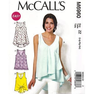 May include: McCall's sewing pattern M6960 featuring various women's tops. The pattern includes designs for tops with different styles, including a V-neck, lace, and tie-front options. The size is ZZ (Lrg-Xlg-Xxl).
