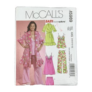 May include: McCall's sewing pattern M5989, size AX5 (4-6-8-10-12), features illustrations of loungewear including a robe, camisole, pants, and shorts. The designs showcase floral and polka dot patterns in pink, green, and white color schemes.