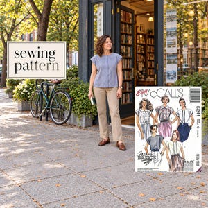 May include: A McCall's 5241 sewing pattern envelope featuring illustrations of five different blouse styles with various necklines, sleeve lengths, and waist details, including a barcode and the text Fashion Basics and Cut-to-Fit.