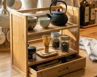 Countertop organizer with drawer keeps coffee, tea, and spices tidy