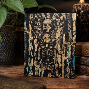 May include: A rectangular canvas painting featuring a central skeletal figure with a skull head, rendered in thick, textured gold paint against a deep black background. Hints of teal blue are visible within the abstract, vertical brushstrokes.