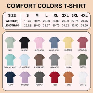Op de afbeelding: Een tabel met Comfort Colors T-shirts in verschillende kleuren, waaronder Bay, Black, Blossom en Blue Jean. De tabel bevat maatvoering, met breedtes vari&euml;rend van 46,35 cm tot 75,57 cm en lengtes van 67,62 cm tot 85,09 cm.