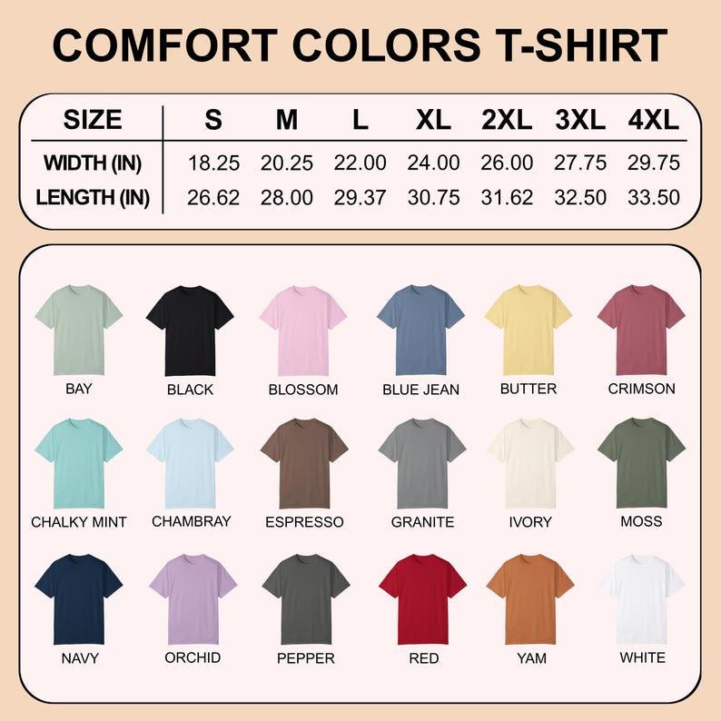 Op de afbeelding: Een tabel met Comfort Colors T-shirts in verschillende kleuren, waaronder Bay, Black, Blossom en Blue Jean. De tabel bevat maatvoering, met breedtes vari&euml;rend van 46,35 cm tot 75,57 cm en lengtes van 67,62 cm tot 85,09 cm.