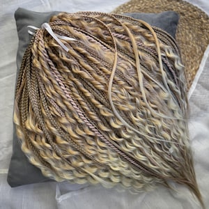 Blonde double ended mix of dreadlocks with braids and curly loose ends, long loose wavy ends, dreadlock and braids extensions