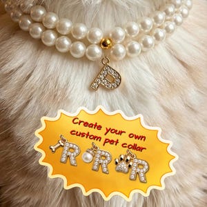 May include: A white ceramic mug with a black handle and the text "But First, Coffee" in a black, handwritten-style font. The mug is on a white surface.