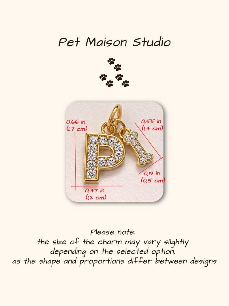 May include: A gold-toned letter P charm encrusted with clear crystals, paired with a small gold-toned bone charm. The letter P measures 0.66 inches by 0.47 inches, and the bone charm measures 0.55 inches by 0.19 inches. Text reads Pet Maison Studio.