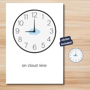 May include: A white ceramic mug with a black handle and the text "But First, Coffee" in a bold, black font. The mug is set against a blurred background, suggesting a cozy setting.