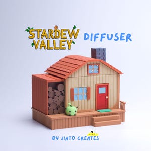 May include: A miniature Stardew Valley diffuser in the shape of a house, featuring a red roof, chimney, and door. The words "Stardew Valley Diffuser" are above the house. A green creature is on the porch.
