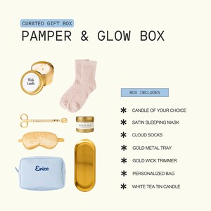The image is a curated gift box containing various items such as a candle, a pair of socks, a pair of scissors, a white tea tin, and a personalized bag.