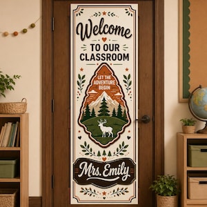 May include: A vertical rectangular classroom door banner featuring the text Welcome TO OUR CLASSROOM, LET THE ADVENTURE BEGIN, and Mrs. Emily. The design includes a central illustration of a white deer, pine trees, and mountains.