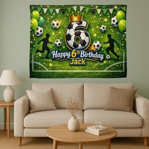 May include: A green soccer-themed birthday banner with the text "Happy 6th Birthday Jack." The banner features a large number 6 made of a soccer ball, soccer balls, and silhouettes of soccer players. Green and yellow balloons and a gold crown are also included.