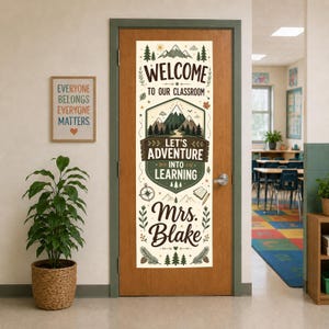 May include: A vertical rectangular classroom door sign featuring a cream background with dark green and brown illustrations of mountains, trees, and a compass. The text reads: Welcome to our classroom, Let's Adventure into Learning, Mrs. Blake.
