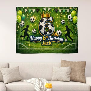May include: A soccer-themed birthday banner with a green field design. The banner features a large number 6 made of a soccer ball, a gold crown, soccer balls, and the text "Happy 6th Birthday Jack."